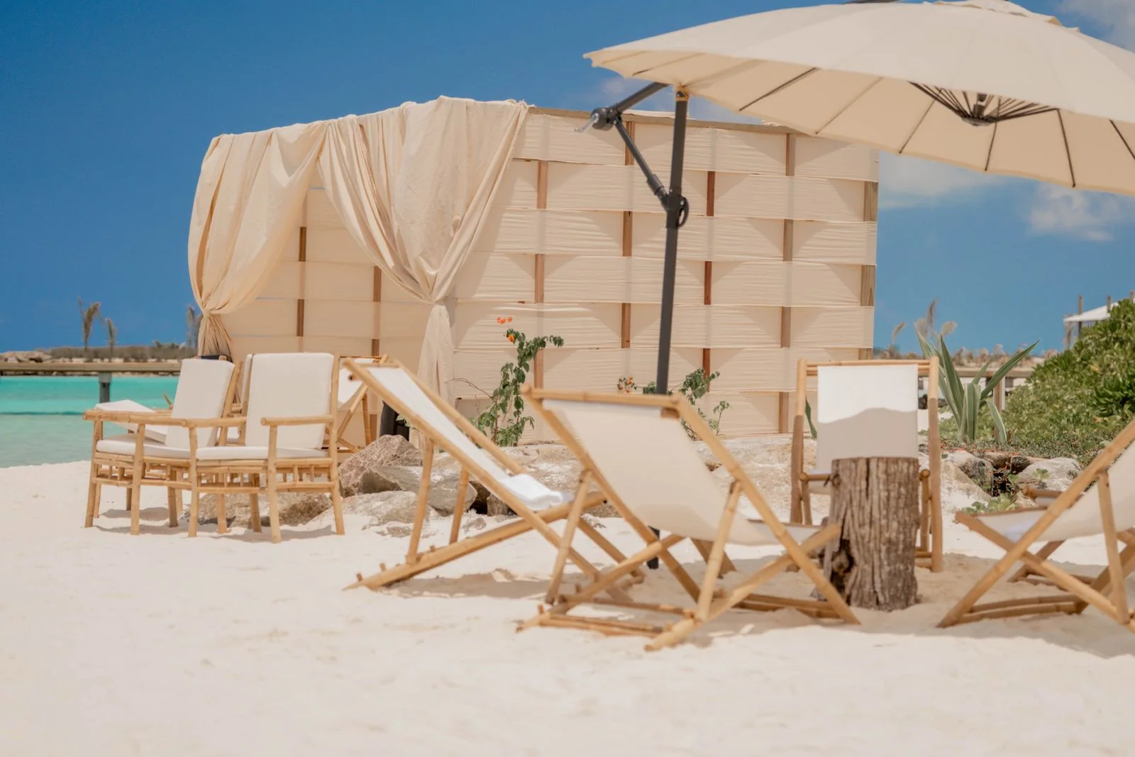 A shaded beachfront cabana at Vahmaafushi